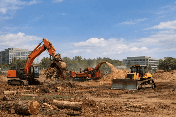 Bulldozer leveling subgrade and clearing construction site footprint